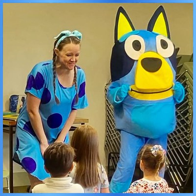 Bluey character and storyteller greeting children at a story time event in Utah